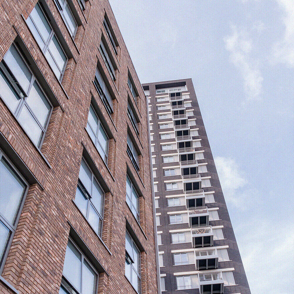 Modern flats building against clear blue sky
