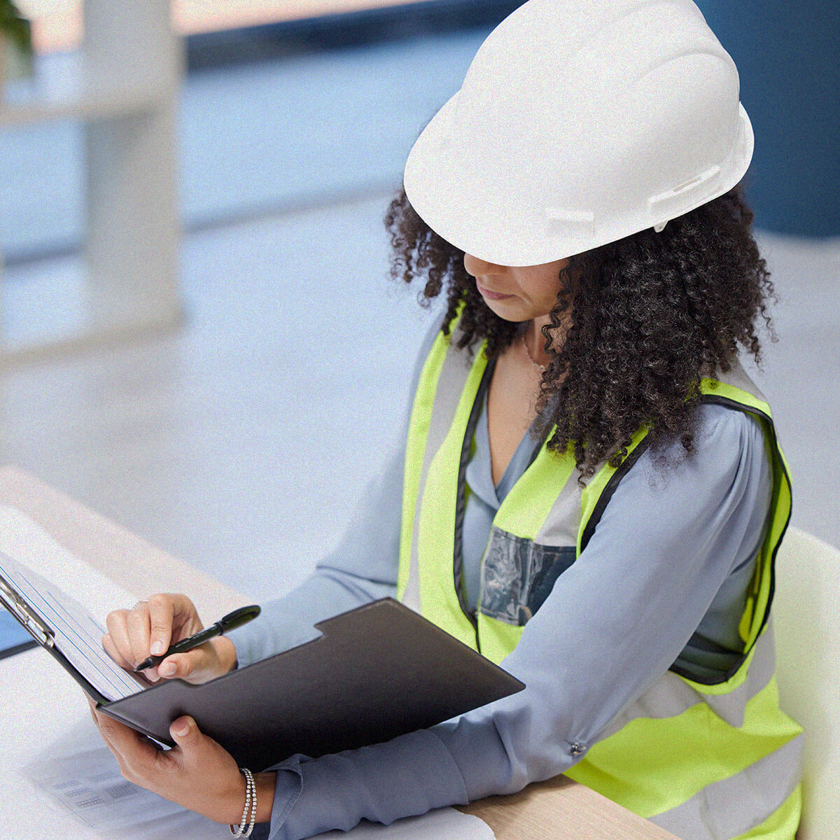 Person filling out construction insurance forms